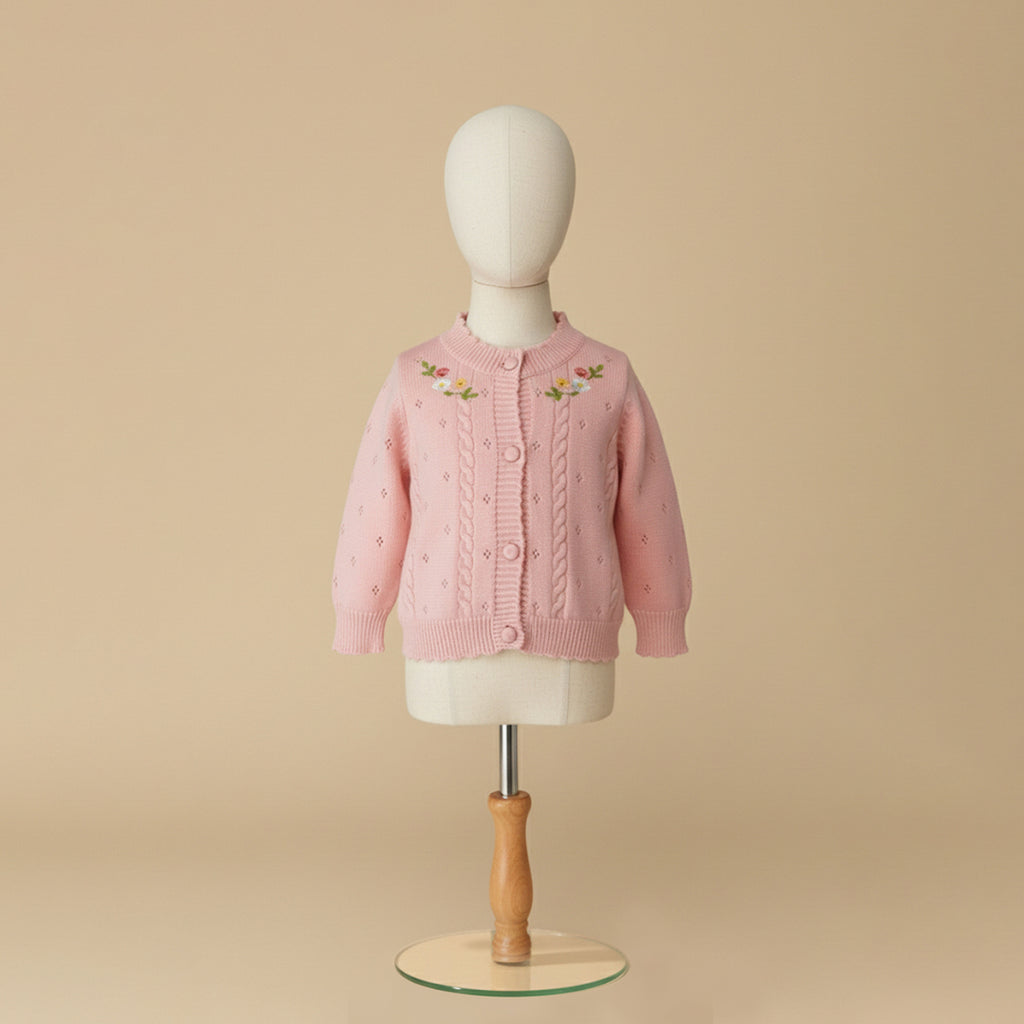 Light dusty pink cardigan with floral embroidery on mannequin display