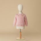 Light dusty pink cardigan with floral embroidery on mannequin display