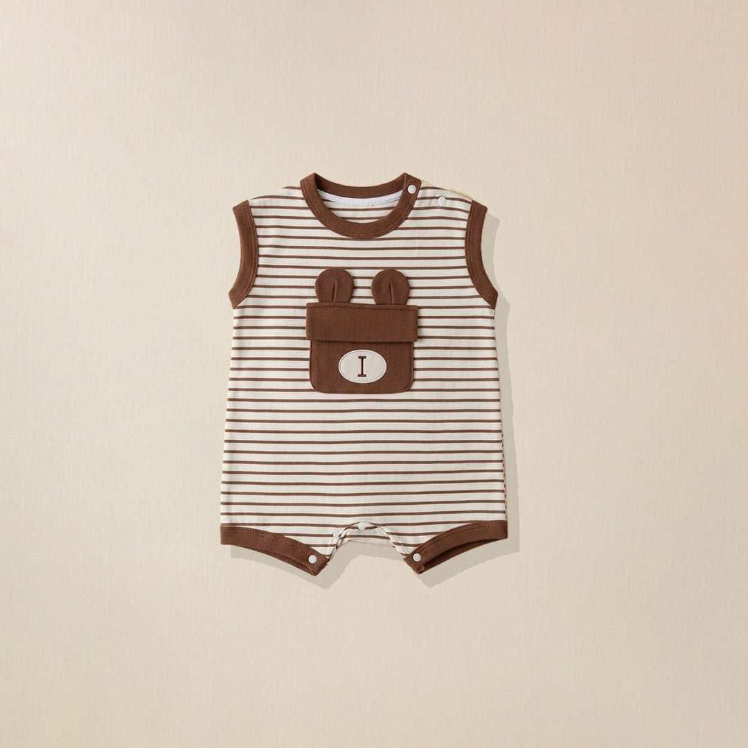 Striped baby romper with bear design pocket on a beige background