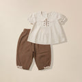 Beige top with floral embroidered collar and brown pants set for girls
