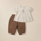 Beige top with floral embroidered collar and brown pants set for girls