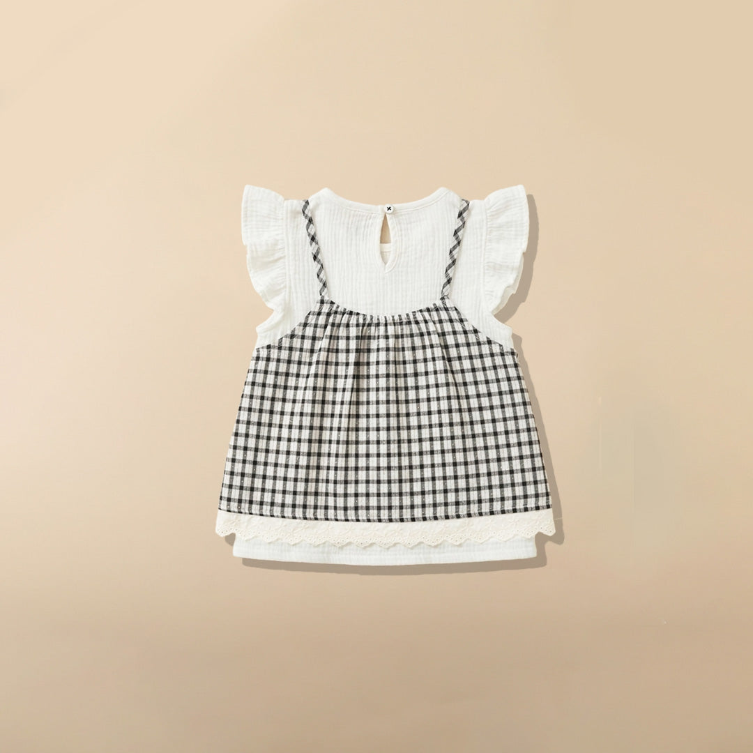 Back view of white ruffle sleeve top with black and white gingham dress