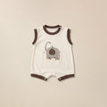 Cream sleeveless romper with brown trim and elephant print for babies
