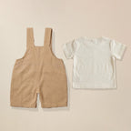 Back view of beige elephant pocket dungaree with white t-shirt for boys