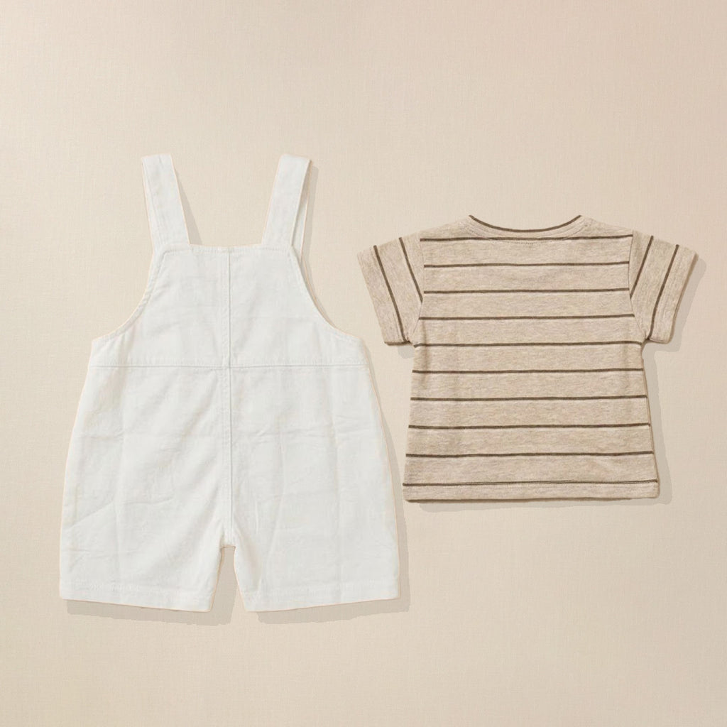 White overalls and striped shirt on a beige background