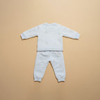 Back view of sky blue quilted baby jacket and pants set
