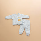 Sky blue quilted baby jacket and pants set with elephant print, flat lay