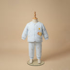 Sky blue quilted baby jacket and pants set on mannequin display