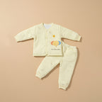Sunny yellow quilted baby jacket and pants set with elephant print, flat lay