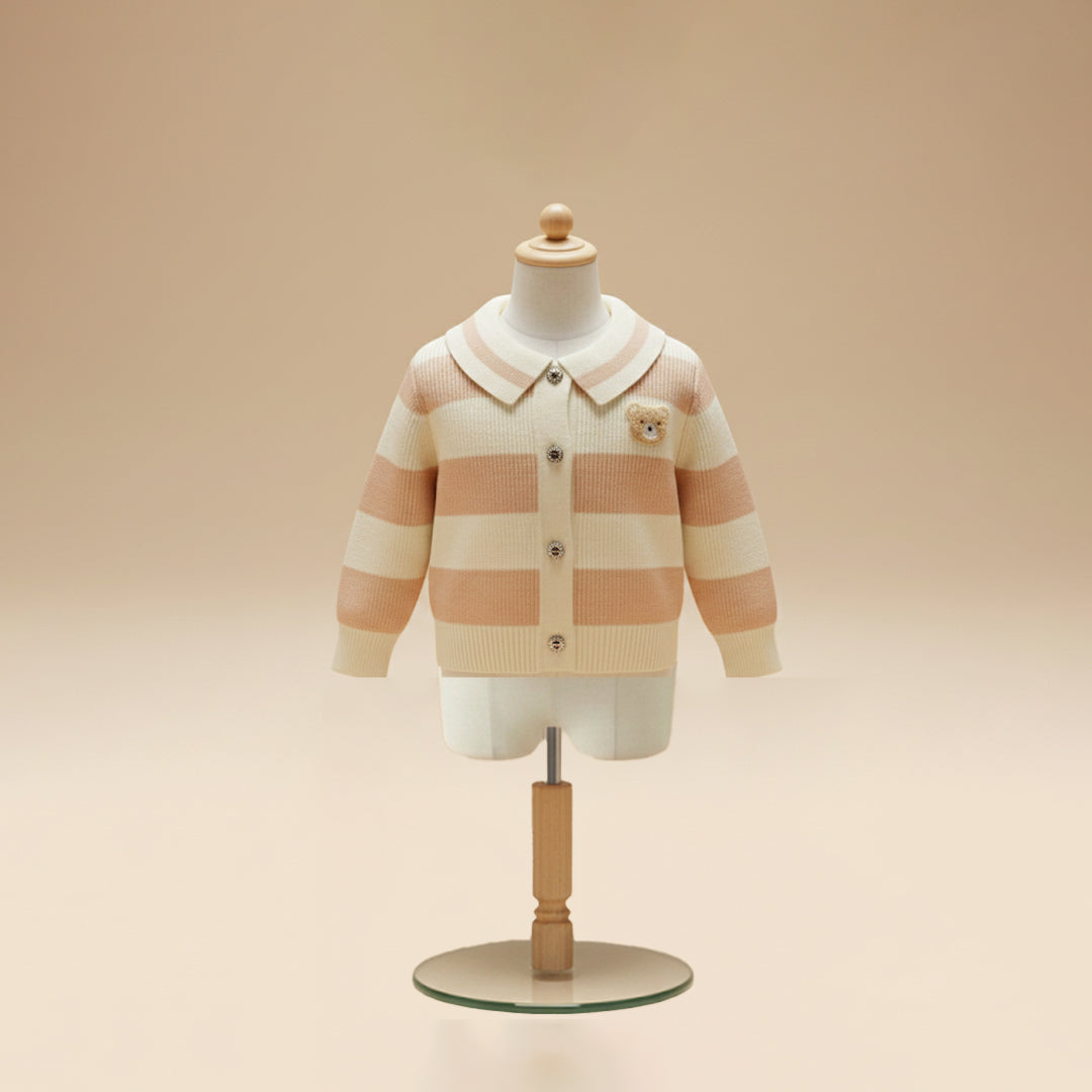 Pink and cream striped cardigan with collar and teddy patch on mannequin