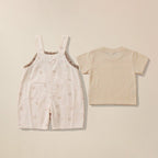 Back view of beige bow print dungaree with matching t-shirt for babies